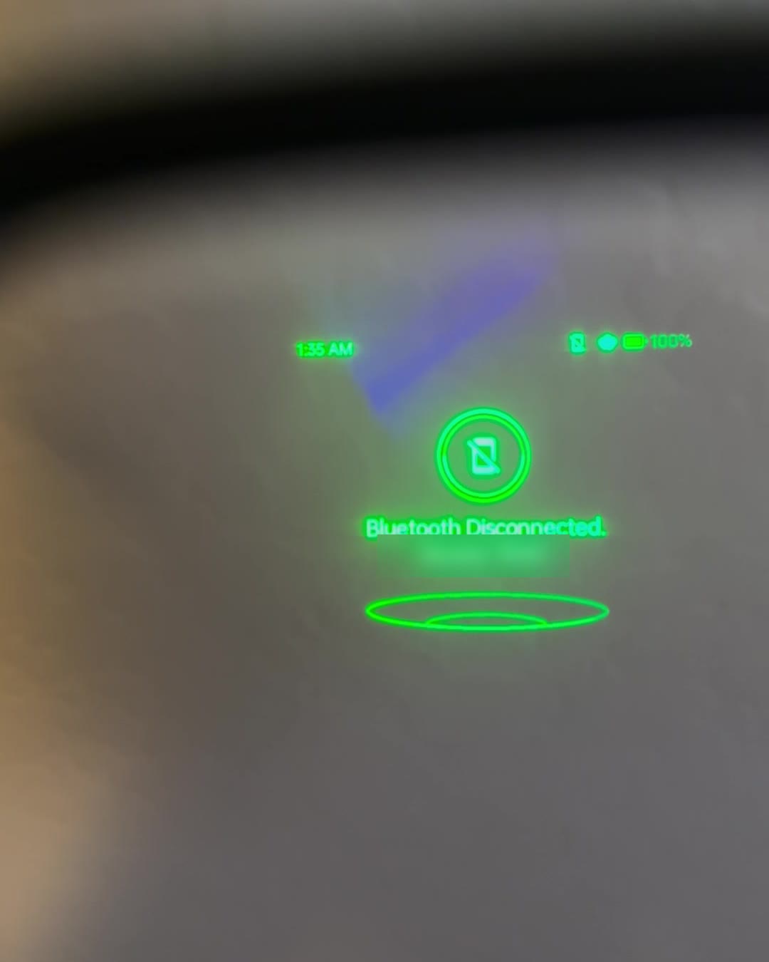 Looking through a MIRA lens: green text showing the time, battery level and a Bluetooth notice